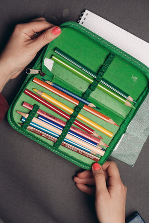 green pencil case with pencils design object school suppliesの写真素材