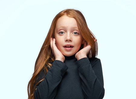 red-haired girl in a black sweater planning close-up
