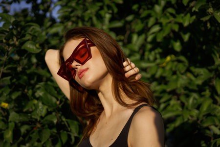 pretty woman in swimsuit and sunglasses summer tropics