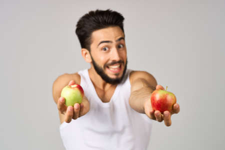 bearded man fresh fruit apples vitamins studio lifestyleの写真素材
