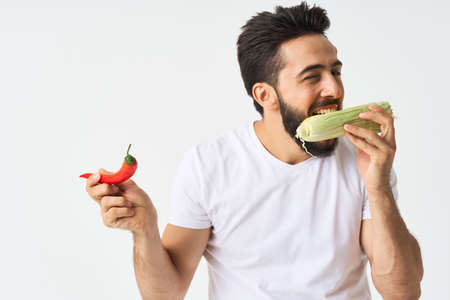 bearded man in white t-shirt vegetables mexican foodの写真素材
