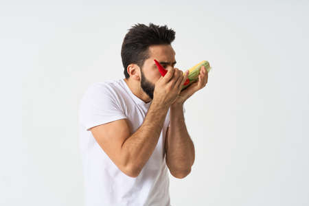 bearded man in white t-shirt vegetables mexican foodの写真素材