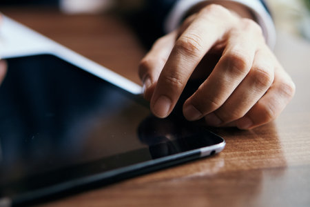 work documents tablet in technology in a cafe