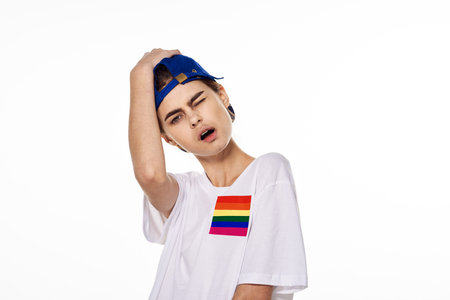 girl in white t-shirt Flag lgbt shemales posing light background