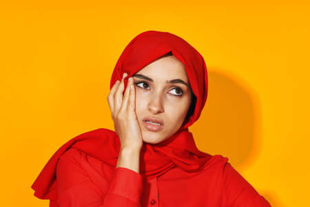 cheerful woman attractive eyes fun gesture hands studio lifestyleの写真素材