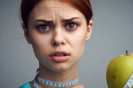 woman with apple in hands diet health vitaminsの写真素材