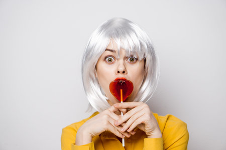 beautiful woman in white wig lollipop fashion