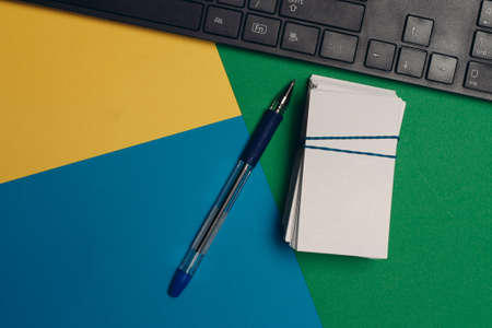 business cards in office supplies colorful background copy-spaceの写真素材