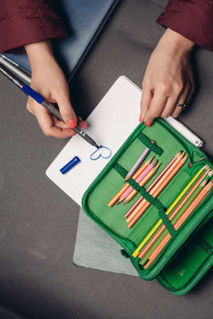 green pencil case with pencils design object school suppliesの写真素材