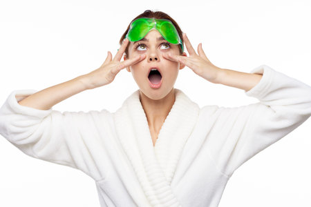 Woman in white robe skin care spa treatments cosmetologyの写真素材