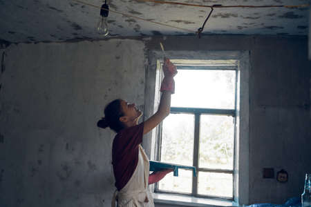 woman paints house decoration interior renovation painterの写真素材