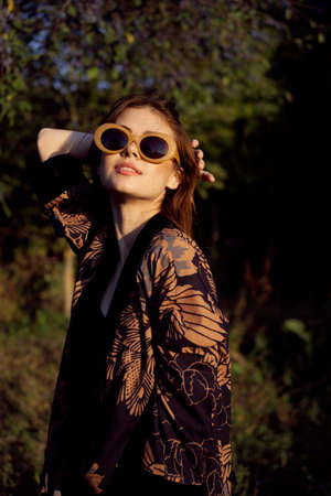 woman wearing sunglasses outdoors posing fashion glamorの写真素材