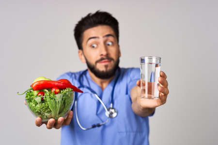 Male nutritionist vegetables healthy food treatment hospitalの写真素材