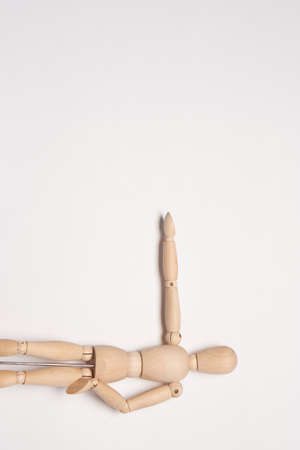 wooden mannequin toy object posing design light backgroundの写真素材