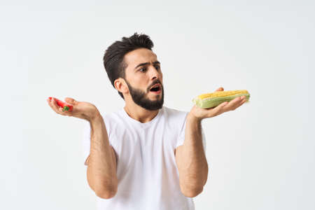 bearded man in white t-shirt vegetables mexican foodの写真素材