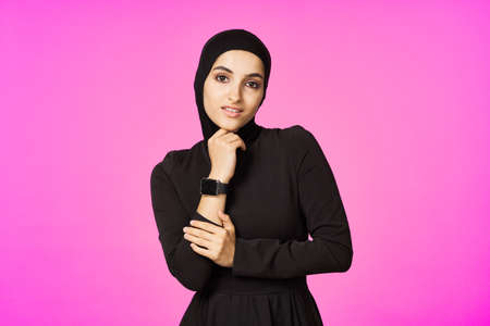 muslim woman in black hijab smart watch technology entertainmentの写真素材