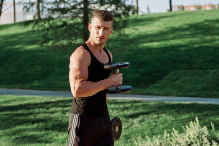 pumped up sports Vykhino in the park with dumbbell workoutの写真素材