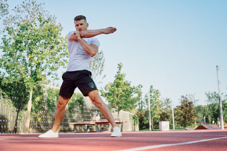 man doing exercises outdoors on the playground