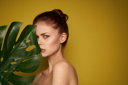cheerful woman bare shoulders red lips posing studio modelの写真素材