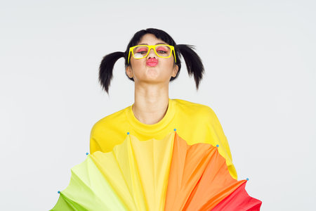 woman with multicolored umbrella fun posing fashion