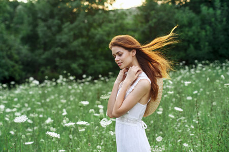 pretty woman in white dress vintage nature posing fashionの写真素材