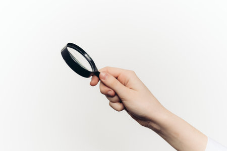 magnifier in hand tool search lcd light background
