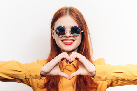 cheerful attractive woman in yellow shirt fashionable clothes sunglasses