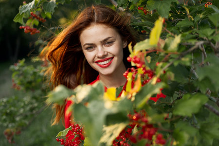 women near bushes nature berries summer lifestyle