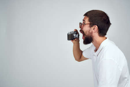 bearded man camera professional technology light backgroundの写真素材