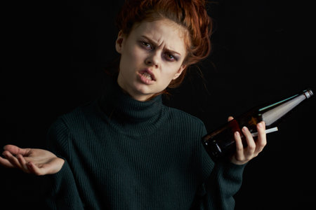 woman with bottle of alcohol bruises under eyes changes depression dark background