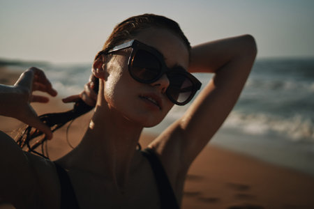 Cheerful woman black swimsuit ocean nature summer tan