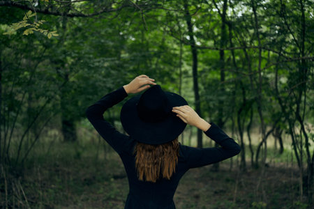 cheerful woman witch in the forest posing fantasyの写真素材