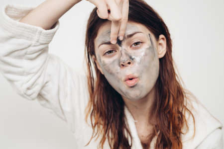 redhead woman facial mask skin care rejuvenationの写真素材