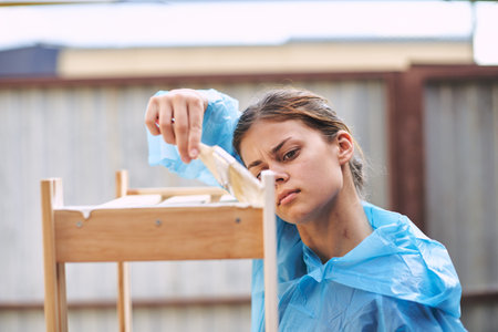 woman paints wooden objects painter decoration home renovation