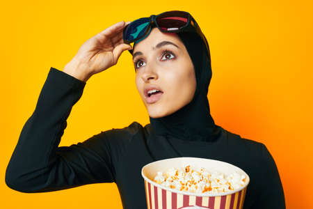 cheerful woman 3D glasses entertainment emotions yellow backgroundの写真素材