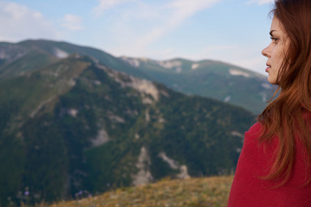 woman with red plaid on nature in the mountains vacation adventure