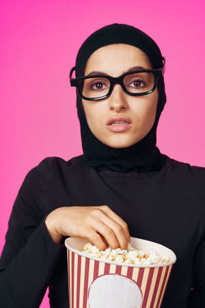 cheerful woman fun popcorn entertainment fashion model ethnicityの写真素材