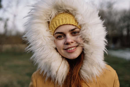 woman outdoors in jacket walk autumn fresh airの写真素材