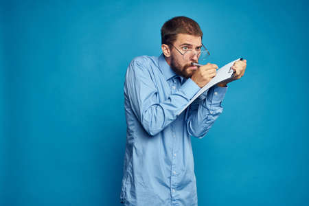 business man with glasses emotions blue backgroundの写真素材