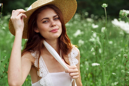 Cheerful woman nature flowers posing freedom fashion