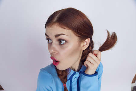 pretty woman with pigtails decoration holiday fun light backgroundの写真素材