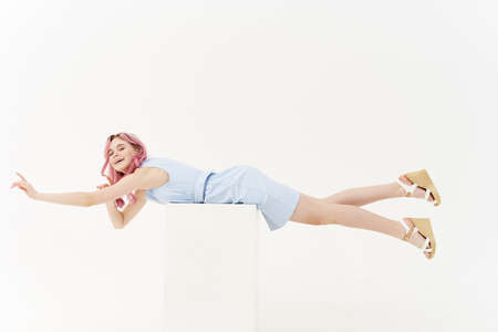 cheerful woman in dress posing full length isolated backgroundの写真素材