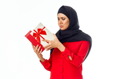 muslim woman with black hijab gifts holiday close-up