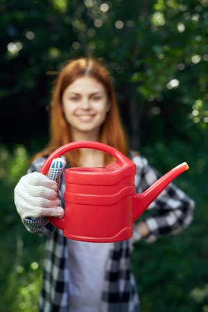 woman gardening trees nature lifestyle green leavesの写真素材