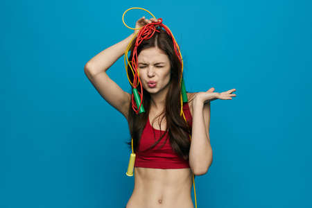 cheerful sportswoman sport equipment training isolated backgroundの写真素材