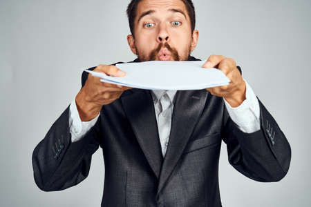 business man with documents in hands emotions manager office professionalsの写真素材