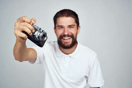 man holding camera professional photographer home light backgroundの写真素材