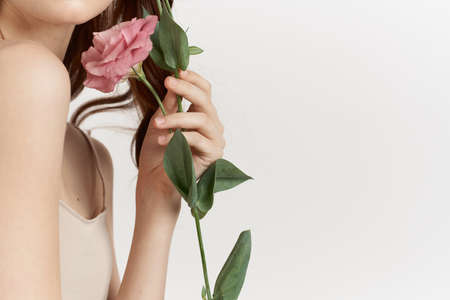 attractive woman flowers in hands posing charm lifestyle glamorの写真素材