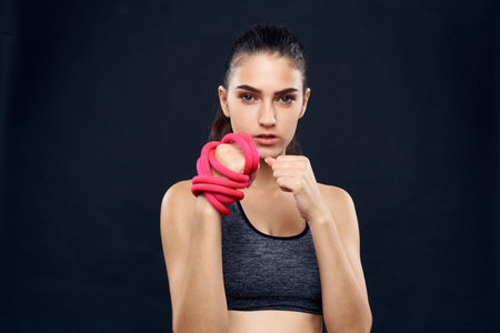 sports woman workout equipment fitness exercise dark background