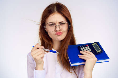 Business woman with calculator notepad working secretaryの写真素材